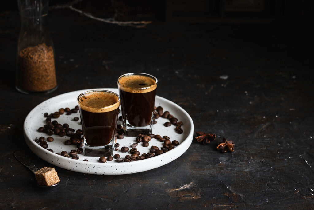 Coffee in glasses. Espresso on a dark background. Dark style