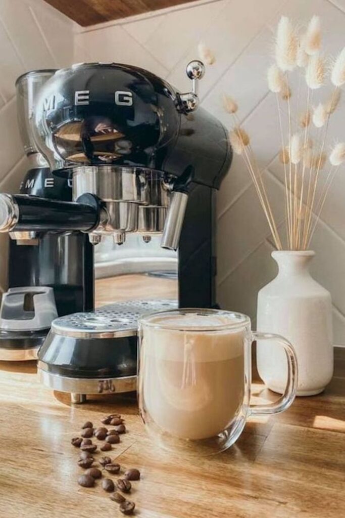 smeg espresso maker cup of coffee and decor